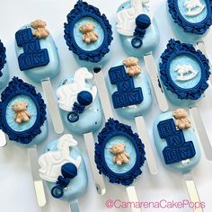 blue and white cupcakes with teddy bears on them