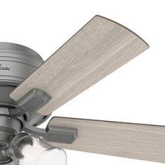 a close up view of a gray ceiling fan with wooden blades and light wood blades