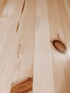 a wooden table with a hole in the center and wood grain on it's surface