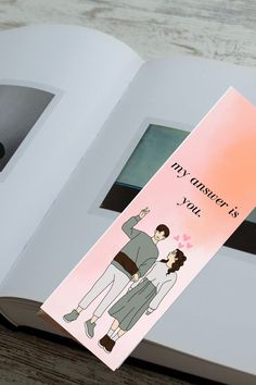 a bookmark with an image of a man and woman hugging each other on it