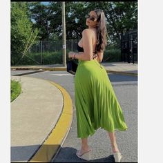 Thick And Smooth, Flowy Satin Effect Pleated Skirt With A Beautiful Sheen On Every Swish. Side Zipper Closure. S: Waist: 13.5" M: Waist: 14.5" Summer Midi Pleated Skirt, Green Stretch Skirt For Summer, Chic Stretch Skirt For Vacation, Chic Full Maxi Skirt For Day Out, Flowy Long Pleated Skirt For Day Out, Trendy Summer Midi Length Bottoms, Trendy Summer Midi Bottoms, Spring Stretch Midi Pleated Skirt, Relaxed Green Pleated Maxi Skirt