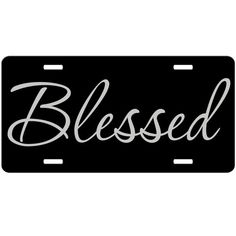 a black and white license plate with the word blessed