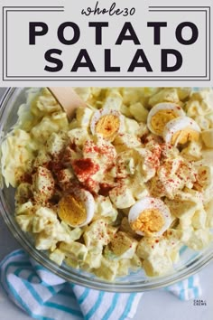 a bowl filled with potato salad on top of a blue and white towel