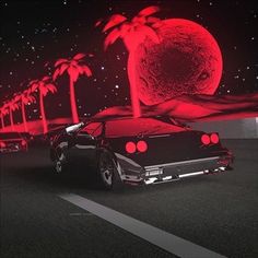 a black car driving down a street next to palm trees and a red moon in the background