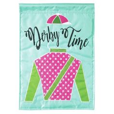 a green and pink towel with the words derby time on it's front end