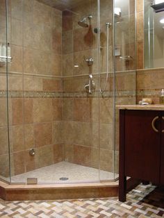 a walk in shower sitting next to a sink