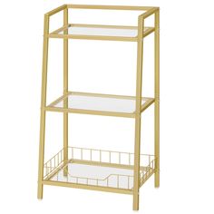 a gold metal shelf with two glass shelves on each side and a wire basket underneath