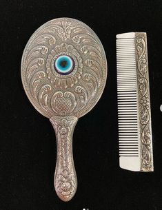 This is a totally hand crafted, real 9.25 carat silver used handheld mirror and a silver-bone comb vanity set.  Check the Measures of set here and select it from the list: Set 1 )  6x13cm  , 53gr    and  11cm bone comb  Set 2 )  6,5x16cm , 66gr and  15cm bone comb  Set 3 )  8x18cm ,101gr     and  15cm bone comb  There is a natural stone replaced behind this mirror. The stones stocks are changing by time, if you dont mention any colour we will send you our pick from stocks. You will see personiza Silver Hand Mirror, Bride Hair Comb, Special Wedding Gifts, Floral Hair Comb, Bride Floral, Comb Set, Floral Hair Combs, Handheld Mirror, Mirror Silver