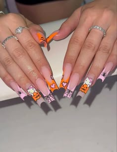 Fall Nails Hello Kitty, Pink Fall Acrylic Nails, Halloween Nails Pink And Orange, Fall Nail Sets Acrylic, Holloween Nails Hello Kitty, Hello Kitty Spooky Nails, Hello Kitty Fall Nails