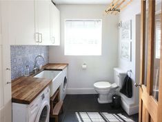 a washer and dryer in a small bathroom