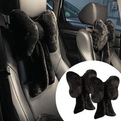 the interior of a car with four plush animal head pillows on the front and back seats