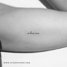 the back of a woman's arm with an inscription on it that reads aluna