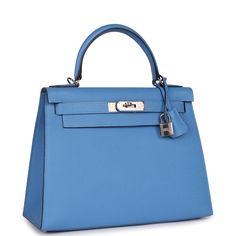 This Kelly, in the Sellier style, is of Bleu Azur epsom leather with palladium hardware, features tonal stitching, a front toggle closure, a clochette with lock and two keys and a single rolled handle.The interior is lined with Bleu Azur chevre and features one zip pocket with an Hermes engraved pull and two open pockets on the opposite side.Collection: TOrigin: FranceCondition: Pre-owned; Mint- This bag retains its shape. Plastic on hardware except turnlock, front flap plaque and shoulder strap Hermes Kelly 25, Kelly Sellier, Hermes Kelly 28, Perfect Handbag, Hermes Box, Togo Leather, Hermes Handbags, Hermes Bags, Virgil Abloh