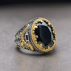 Add a touch of elegance to your look with this stunning 925 sterling silver Turkish handmade men's ring featuring a majestic onyx stone. Handcrafted with care and attention to detail, this ring is the perfect accessory to elevate any outfit. Whether you're dressing up for a special occasion or adding a pop of color to your everyday style, this unique piece is sure to turn heads. Make a statement with this luxurious and eye-catching ring that combines traditional Turkish design with modern flair. Classic Signet Ring With Stone Setting As Gift, Classic Signet Ring With Stone Setting For Gift, Classic Rings With Stone Setting As Gift, Classic Rings With Stone Setting For Gift, Mens Black Ring, Turkish Design, Black Onyx Ring, Onyx Ring, Men's Ring