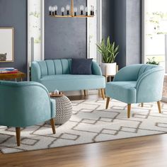 a living room with blue walls and furniture