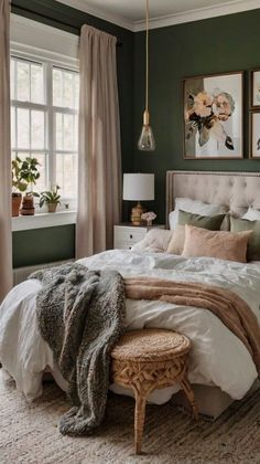 a bedroom with green walls and white bedding