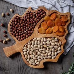 nuts and dried fruits in wooden bowls on a table