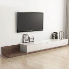 a flat screen tv mounted to the side of a wall