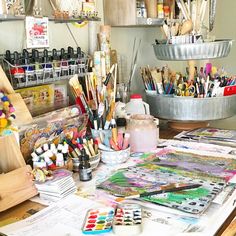 art supplies are sitting on a table in a studio