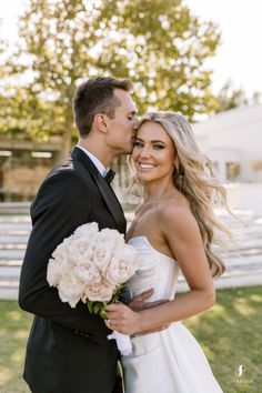 a bride and groom pose for a wedding photo