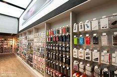 the inside of a cell phone store with lots of phones on display and boxes full of them