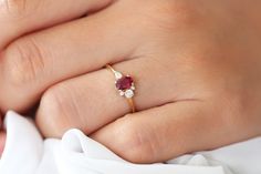 "Ruby Ring / Cluster Engagement Ring / Red Ring / Ruby Engagement Ring / Oval Shape Engagement Ring / Ruby Cluster Ring / Ferkos Fine Jewelry The Rubies are Natural Genuine Ruby (NON-ENHANCED), also Available in other Gemstones, please inquire Item Details *Made to Order. *Gold Kt: 14K Solid Gold *Custom Gold Color: Rose Gold, Yellow Gold, White Gold *Pear Shape Diamond: 1 Pc 3x2MM *Round Cut Diamond: 2pcs 1.55MM *Round Cut Diamond: 1pcs 2.70MM *Natural Genuine Ruby: Oval Cut *Oval Cut Ruby: 1pc Classic Red Oval Diamond Ring, Oval Ruby Ring With Red Accent Stones, Red Oval Birthstone Ring With Prong Setting, Red Ruby Ring With Oval Accent Stones, Oval Ruby Rings Suitable For Gifts, Red Ruby Ring With Oval Cut And Accent Stones, Red Ruby Ring With Oval Shape And Accent Stones, Oval Ruby Rings For Gift, Classic Oval Lab-created Ruby Ring