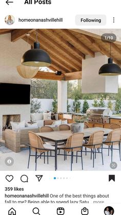 an outdoor kitchen and dining area with wood ceilinging, white tile floors and large windows