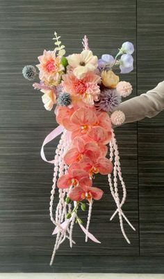 a bouquet of flowers hanging from the ceiling