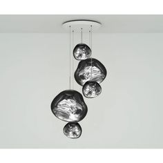 three glass balls hanging from the ceiling