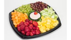 a platter filled with different types of fruit