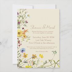 a wedding card with colorful flowers on it