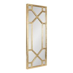 a gold framed mirror on a white wall