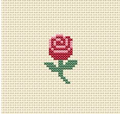 a cross stitch rose on a white background