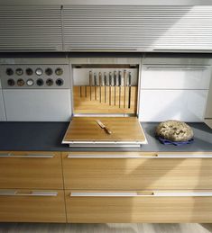 a kitchen counter with a cutting board and knife