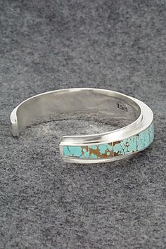 This stunning turquoise and sterling silver bracelet was expertly crafted by Navajo silversmith Harold Smith. The inside of the cuff is signed H. Smith and stamped Sterling.Size: 5 3/8" (will fit up to a 6 5/8" wrist)Gap: 1 1/4"Width: 5/8"Cuff Width: 5/8" tapered to 3/8"Free shipping on all orders! We ship with USPS and always include tracking. All orders ship within a day of payment.Returns are accepted up to 30 days after you receive your order. Just send us a message. Our shop offers cash back or store credit. The item must be returned in new condition. Southwestern Turquoise Cuff Bracelet With Inlay, Southwestern Style Turquoise Cuff Bracelet With Inlay, Adjustable Turquoise Cuff Bracelet With Polished Finish, Adjustable Turquoise Polished Cuff Bracelet, Turquoise Sterling Silver Cuff Bracelet With Polished Finish, Southwestern Turquoise Bracelet With Polished Finish, Sterling Silver Turquoise Cuff Bracelet With Inlay, Turquoise Sterling Silver Cuff Bracelet With Inlay, Southwestern Turquoise Bracelets With Polished Finish