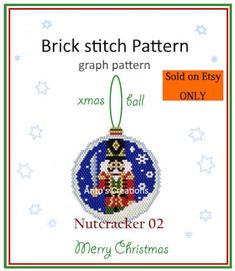 a cross stitch ornament with the words, christmas ball and nutcracker on it