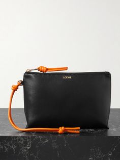 Loewe's 'T-Knot' pouch is perfect for slipping into a tote or carrying as a clutch on evenings out. Crafted from leather, it has contrasting knotted straps and two internal slots for your most-used cards. Matching Separates, Loewe Bag, Sports Trousers, Raffia Bag, Ballet Pumps, Orange Leather, Mini Handbags, Leather Pouch, Clothes Collection