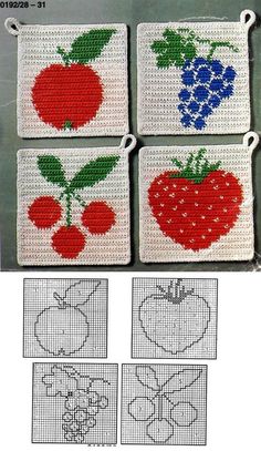 four cross stitch coasters with fruits and berries on them, one is red, the other is blue