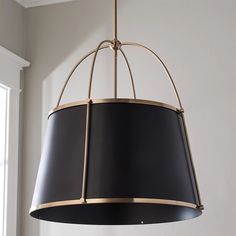 a black and gold chandelier hanging from a ceiling