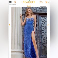 a woman in a blue dress standing next to a column with the word peaches on it