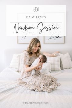 a woman sitting on top of a bed with a baby in her lap and the words, baby levi's newborn session