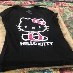 Hello Kitty Tshirt Pink And Black Size Large Casual Pink Hello Kitty T-shirt, Cute Black T-shirt With Cat Design, Trendy Pink Hello Kitty T-shirt, Pink Hello Kitty Crew Neck T-shirt, Pink Cotton Hello Kitty T-shirt, Y2k Black Hello Kitty Print Top, Black Hello Kitty Print Short Sleeve Top, Hello Kitty Casual Crew Neck T-shirt, Casual Black Hello Kitty Print Top