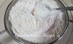 a bowl filled with white powder and a spoon