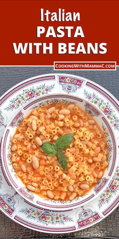 a bowl of pasta with beans and basil