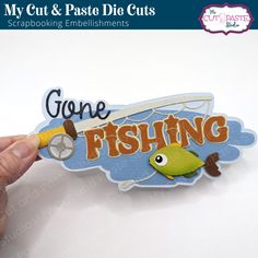 someone is holding up a sticker that says gone fishing with a fish on it