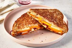 a grilled cheese sandwich cut in half on a plate