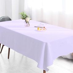 a white table cloth on top of a wooden table