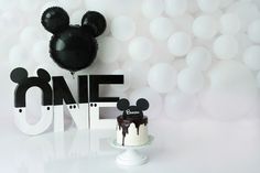 a mickey mouse cake sitting on top of a table