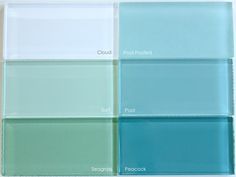 four different shades of glass sitting on top of each other in front of a white wall