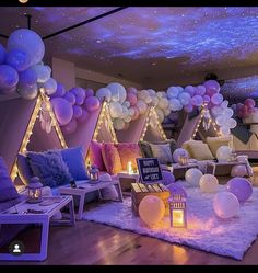 a room filled with lots of balloons and lights